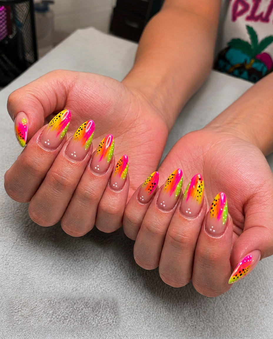 Neon pink, orange and green brushstroke almond nails with black dots